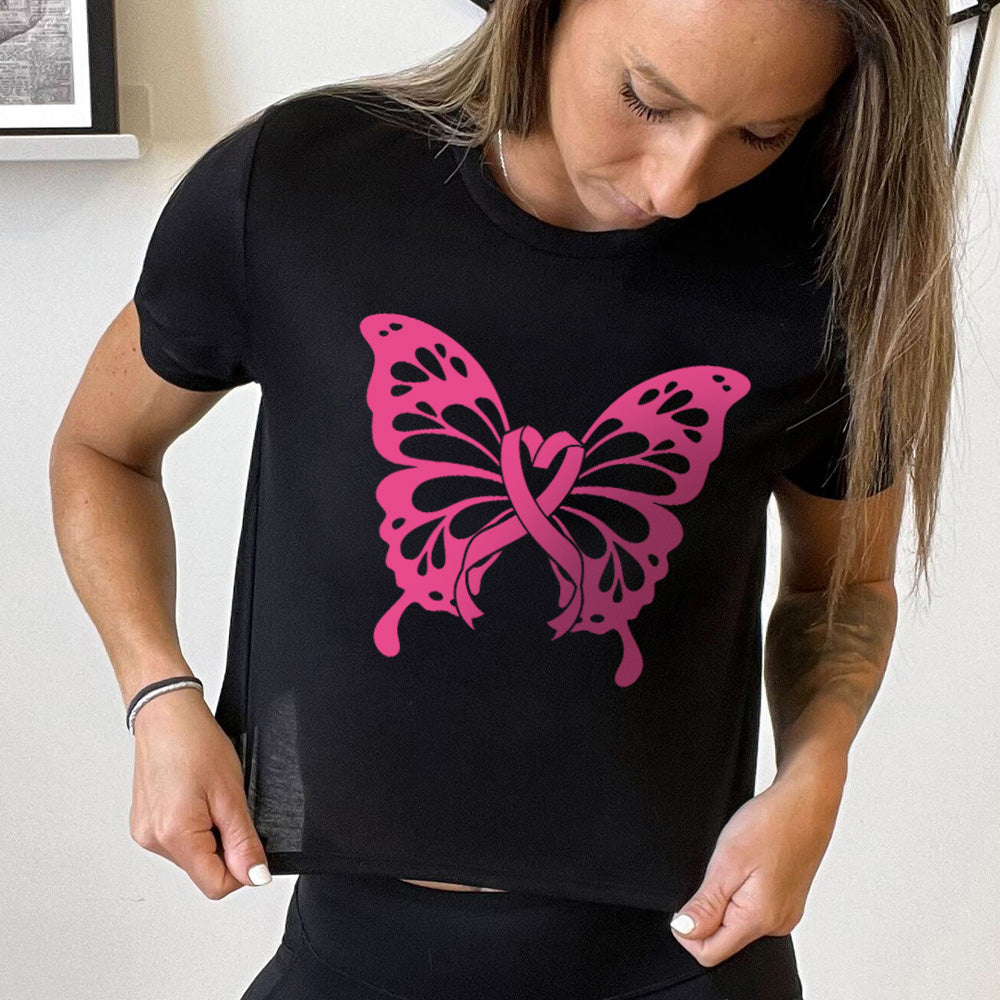 Woman wearing a black t-shirt with a pink butterfly design.
