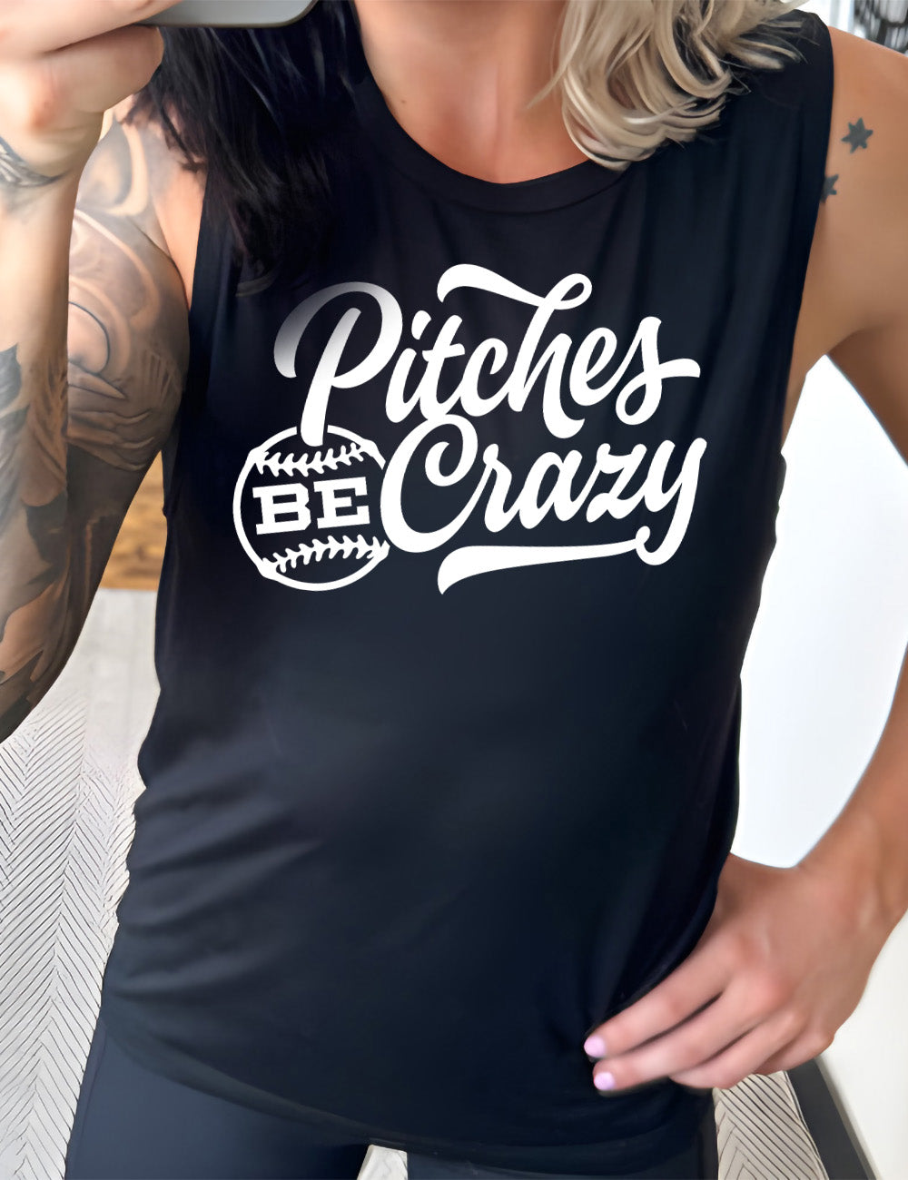 black muscle tank with the words "pitches be crazy" on it, with the word "be" inside of a baseball outline graphic