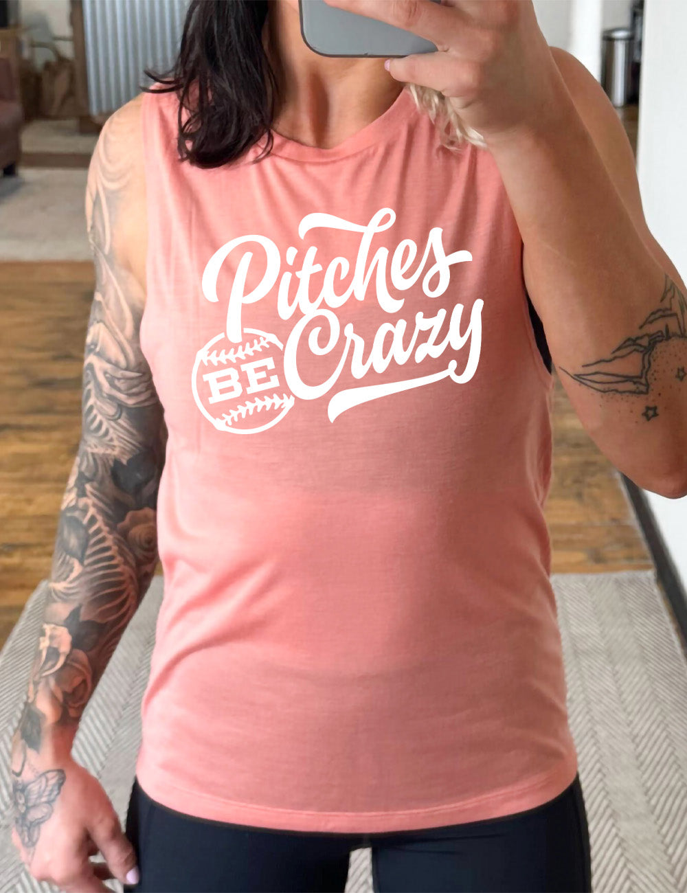 peach muscle tank with the words "pitches be crazy" on it, with the word "be" inside of a baseball outline graphic