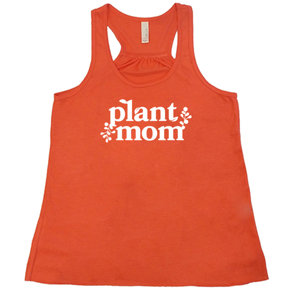 Coral colored flowy tank with a plant graphic on it that says "Plant Mom"