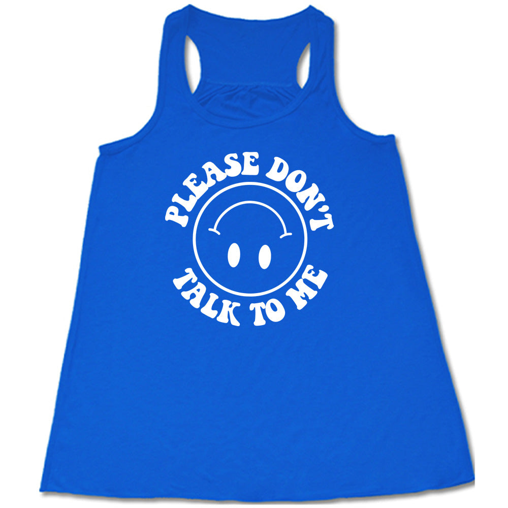 blue flowy tank with the words "please don't talk to me" creating mirrored arcs around the outlined circle graphic of an upside-down happy face