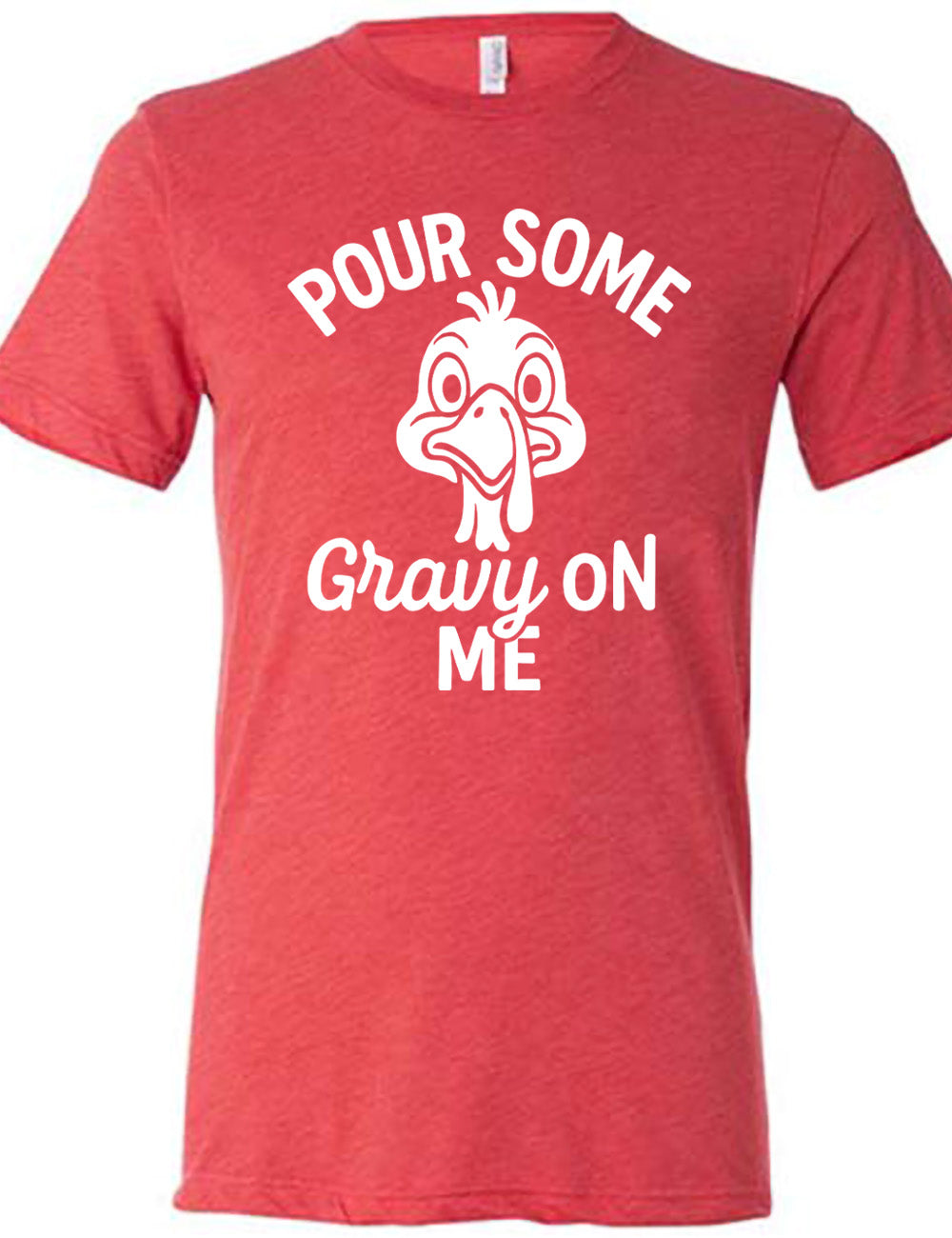 red unisex tee with the words "pour some gravy on me" on it, with "gravy" in cursive", and the words "pour some" slightly arching over the graphic of a turkey's head, eyes wide