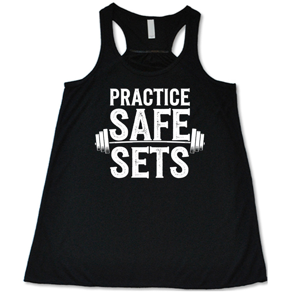 black flowy tanks with the words "practice safe sets" on it, with the image of a barbell