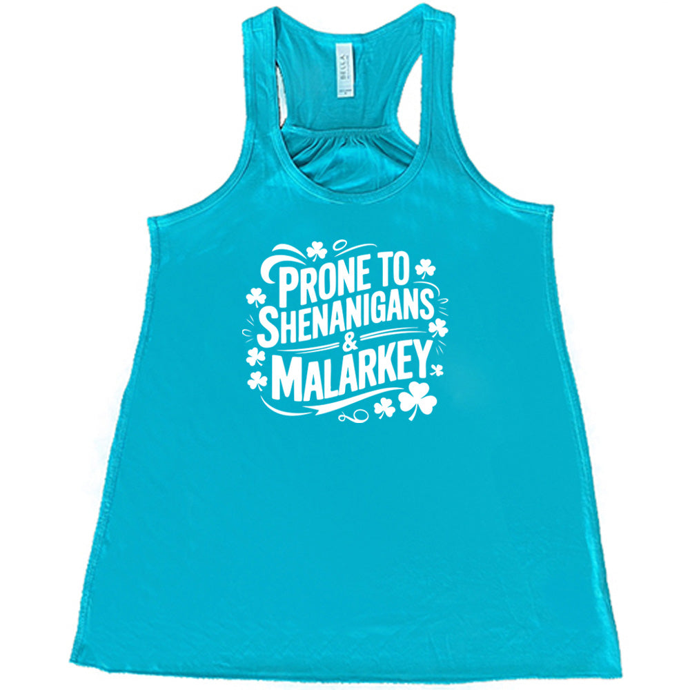 teal shirt with the quote "Prone To Shenanigans & Malarkey" on it