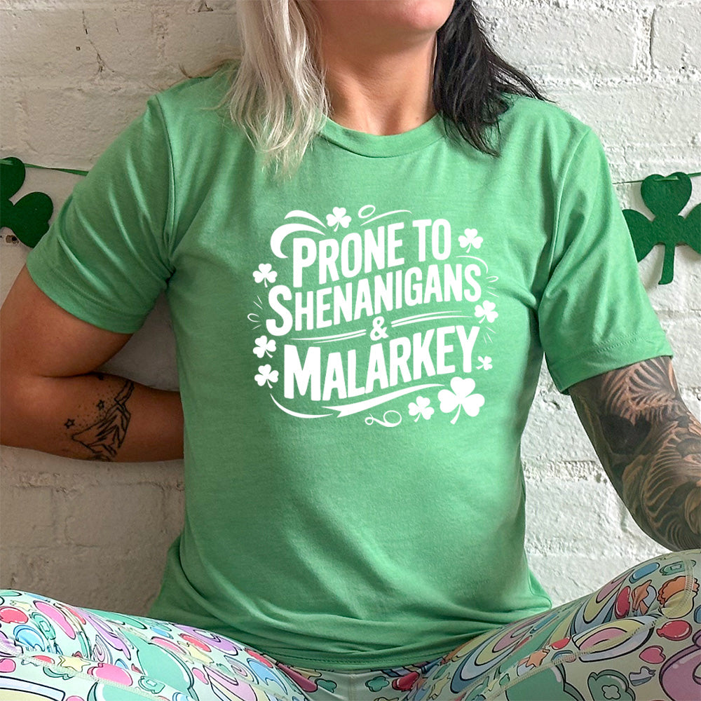 green shirt with the quote "Prone To Shenanigans & Malarkey" on it
