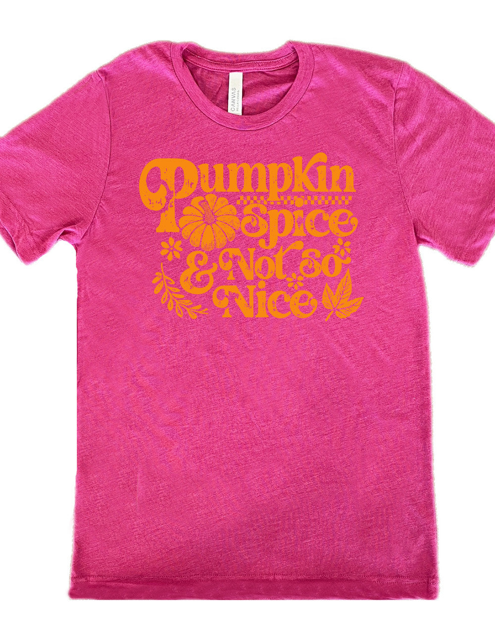 berry unisex tee with the words "pumpkin spice & not so nice" and a top-down view of a pumpkin graphic to the left of the word "spice" and a checkered banner above the same word, and a few leaves and plants around the other words
