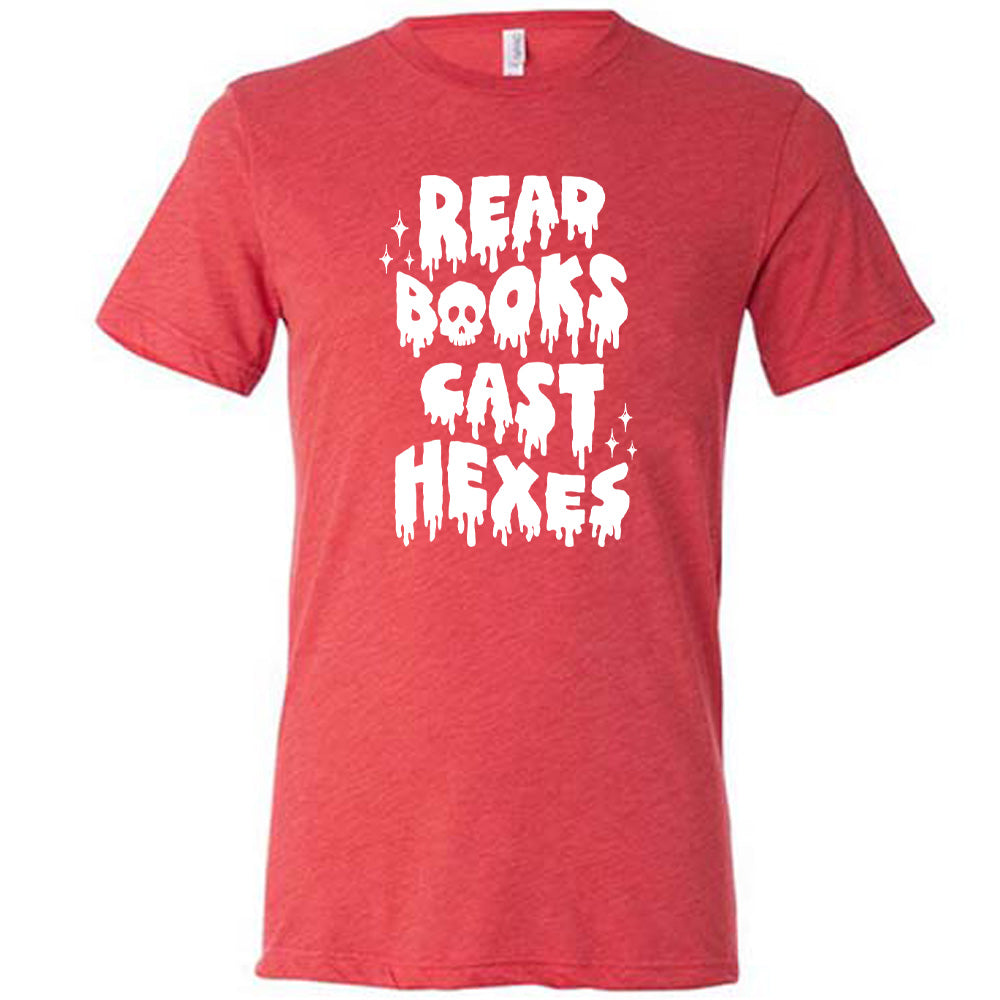 red shirt with the text "Read Books Cast Hexes" on it