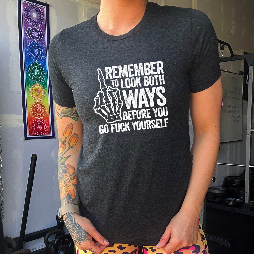 Black colored shirt with a skeleton's middle finger graphic on it that says "Remember To Look Both Ways Before You Go Fuck Yourself"