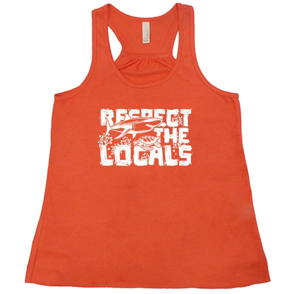 Coral colored flowy tank with a shark and turtle graphic on it that says "Respect The Locals"