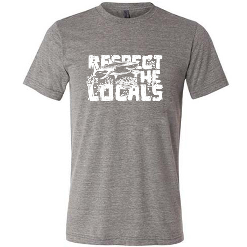 Grey colored shirt with a shark and turtle graphic on it that says "Respect The Locals"