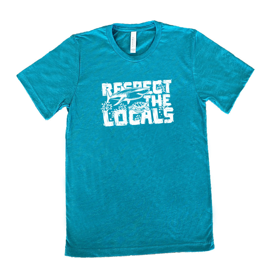 Teal colored shirt with a shark and turtle graphic on it that says "Respect The Locals"