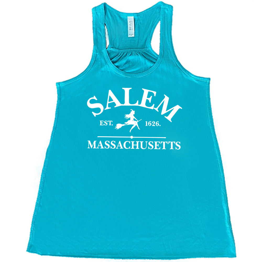 Teal colored flowy tank with witch on a broom graphic on it that says "Salem EST. 1626 Massachusetts"