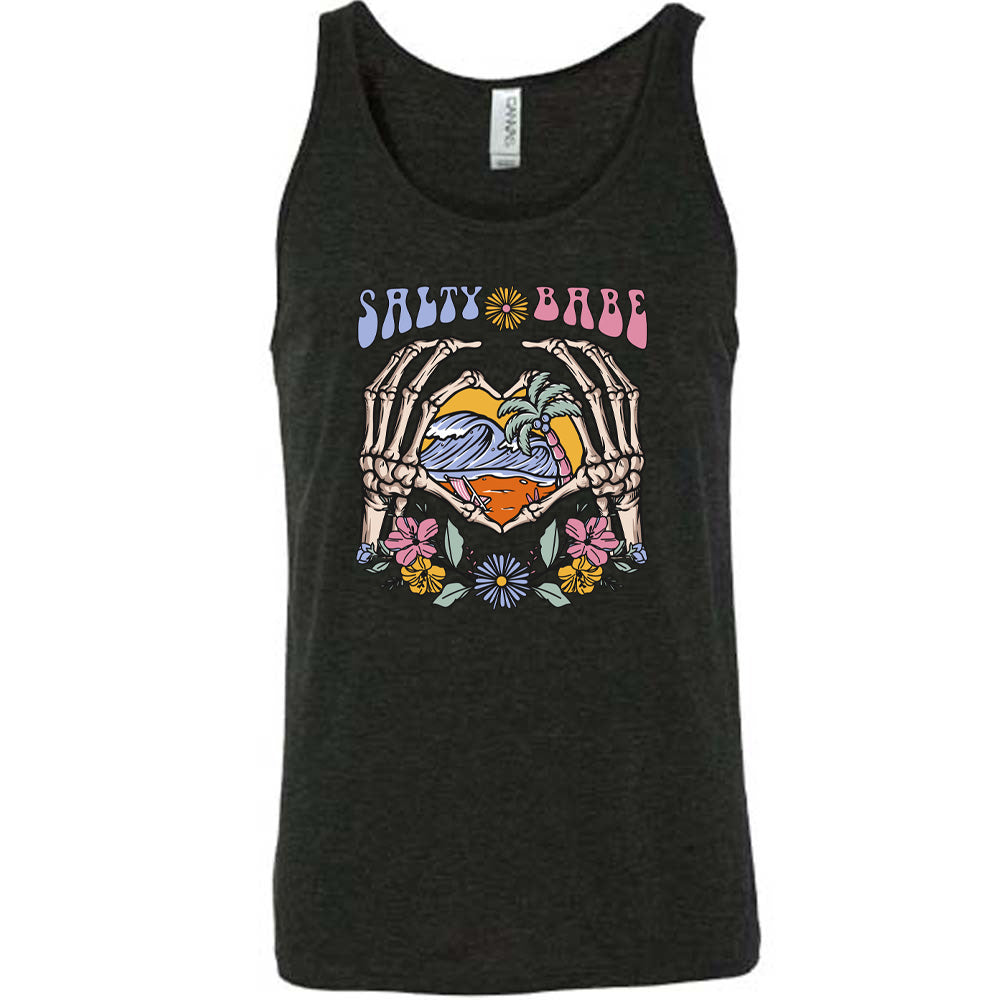 Black colored tank with a skeleton heart hands around ocean waves graphic on it that says "Salty Babe"