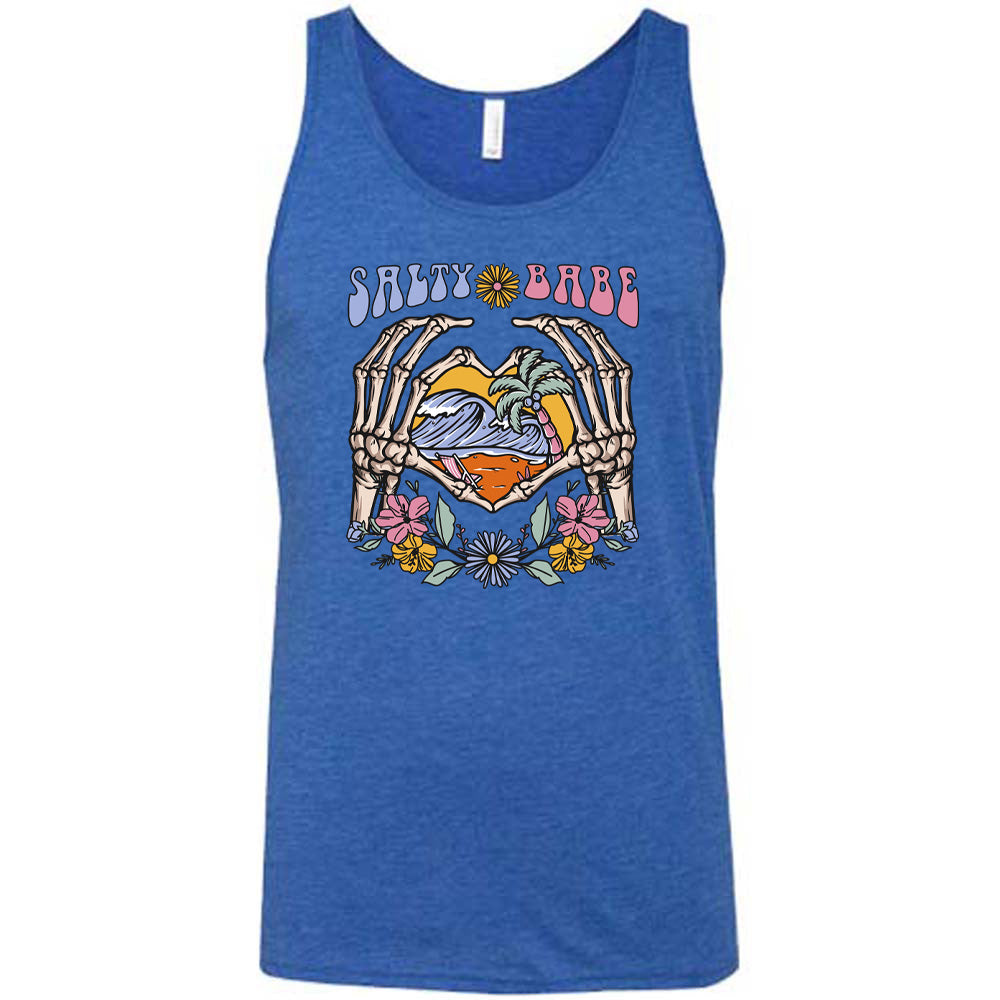 Blue colored tank with a skeleton heart hands around ocean waves graphic on it that says "Salty Babe"
