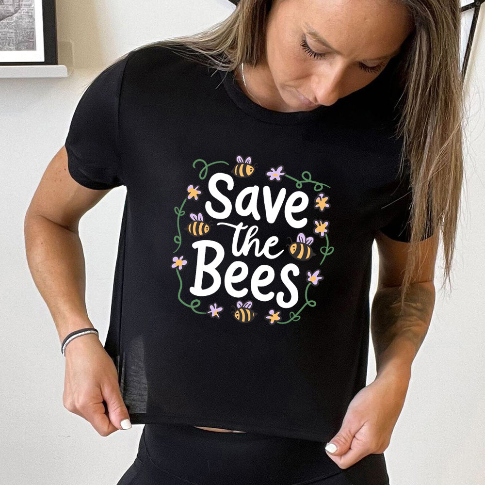 Black colored cropped tee with a bees and flowers graphic on it that says "Save The Bees"
