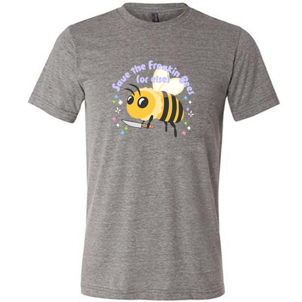 Grey colored shirt with a bee holding a knife graphic on it that says "Save The Freakin Bees (Or Else)"