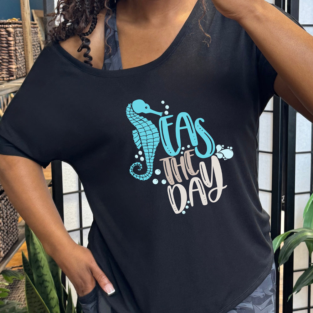 Black colored shirt with a seahorse graphic on it that says "Seas The Day"