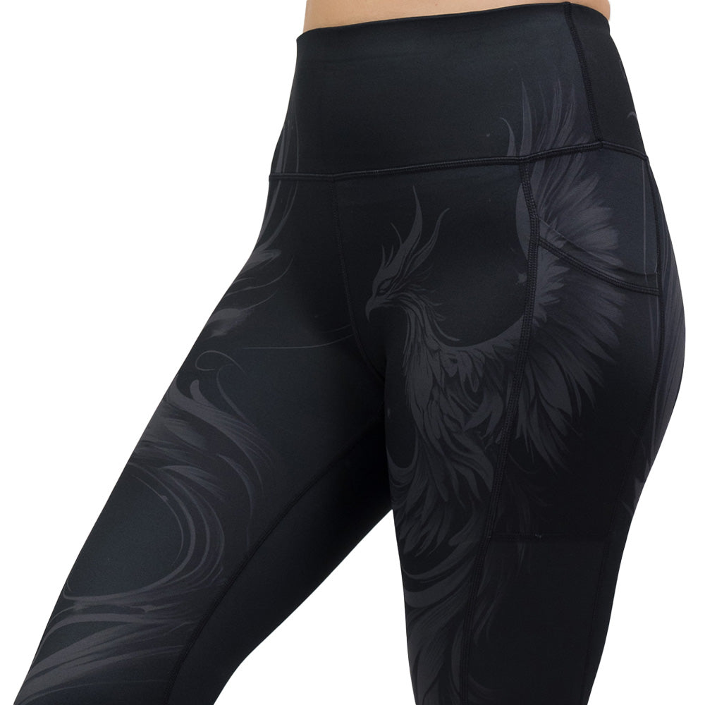 Black leggings with a phoenix design on them
