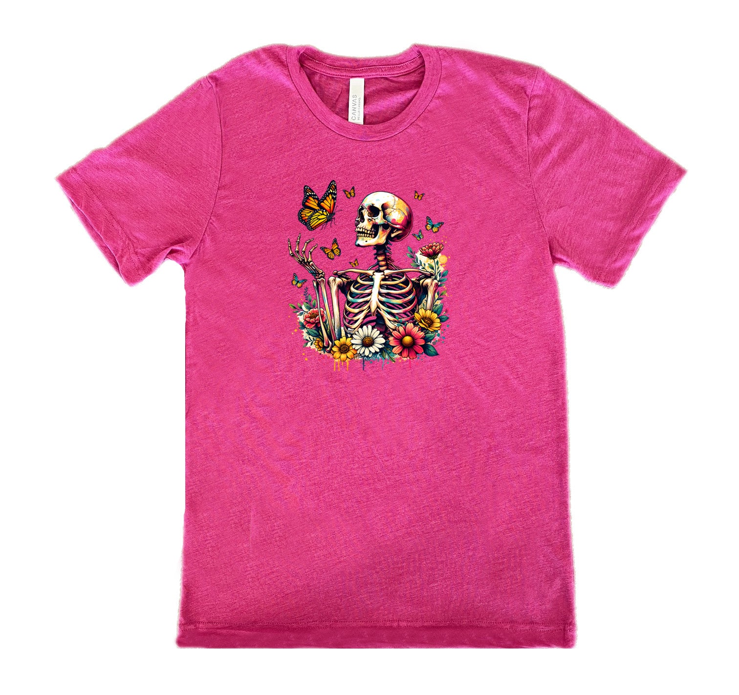 Berry colored shirt with a skeleton, butterflies, and flowers graphic on it
