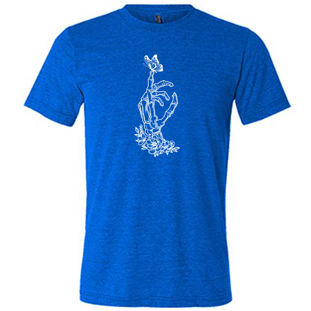 Blue colored shirt with a butterfly on a skeletons hand graphic on it