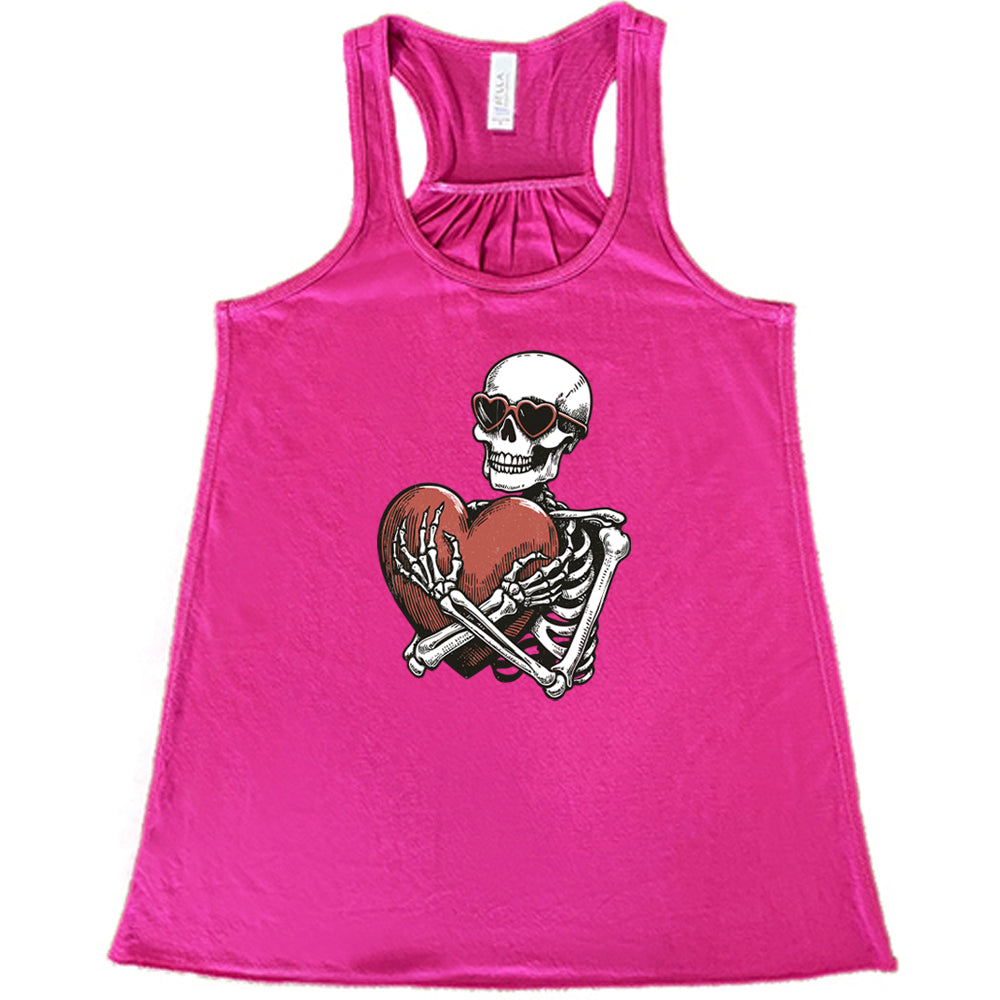 berry shirt with a skeleton hugging a heart graphic on it