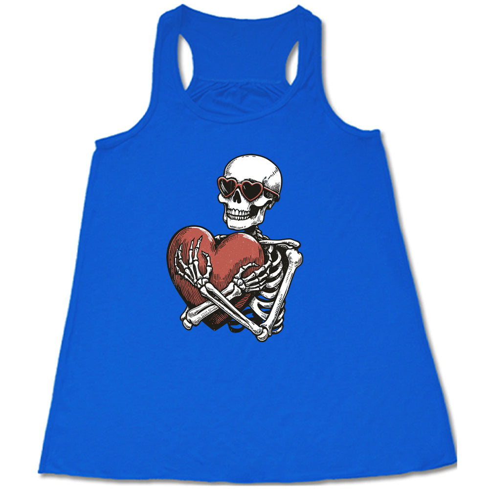 blue shirt with a skeleton hugging a heart graphic on it