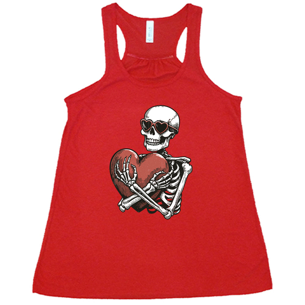 red shirt with a skeleton hugging a heart graphic on it