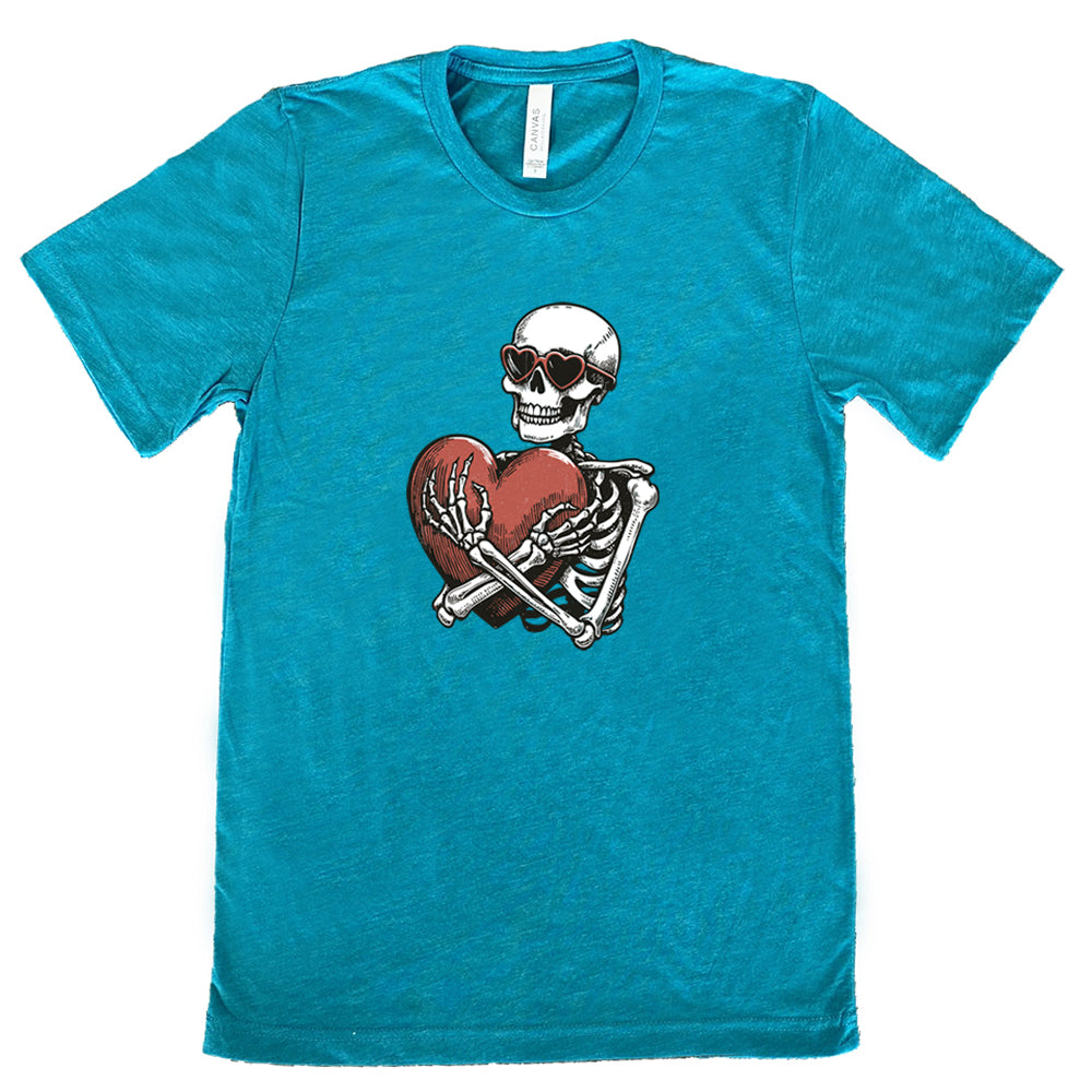 teal shirt with a skeleton hugging a heart graphic on it