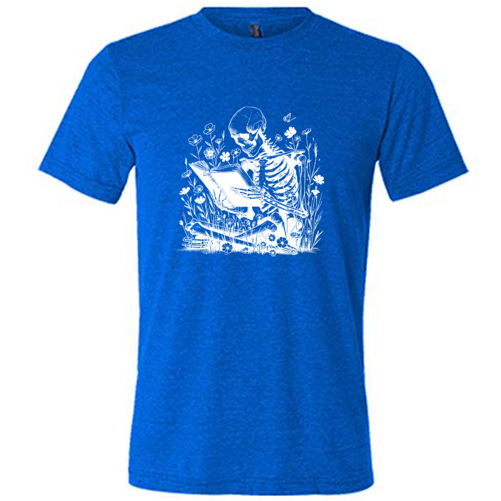 blue shirt with a skeleton reading graphic on it