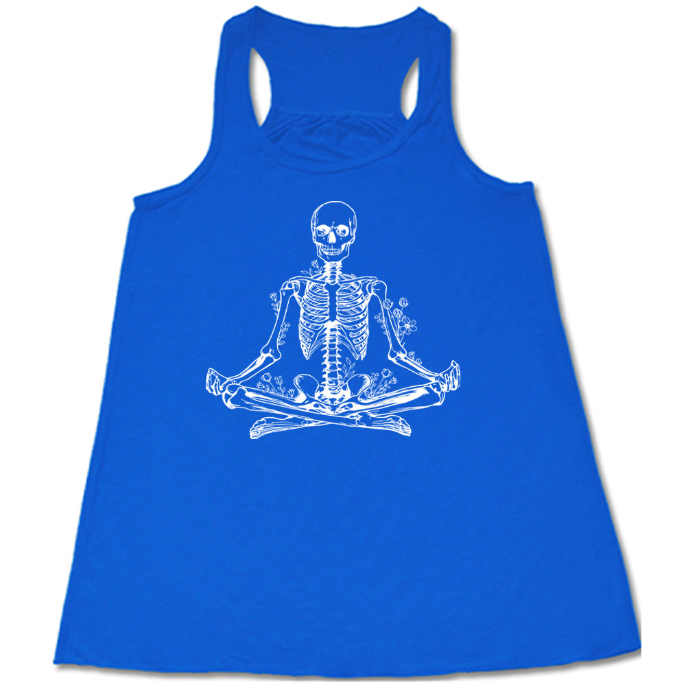 Blue flowy tank with a graphic of a skeleton doing a yoga pose, with some flowers growing out of different place on the body