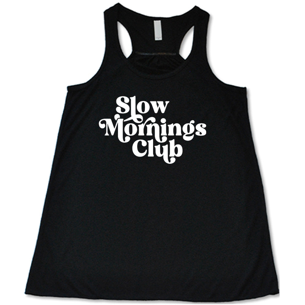 Black colored flowy tank with a graphic on it that says "Slow Mornings Club"