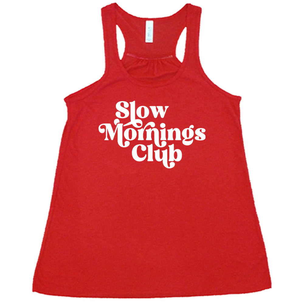 Red colored flowy tank with a graphic on it that says "Slow Mornings Club"
