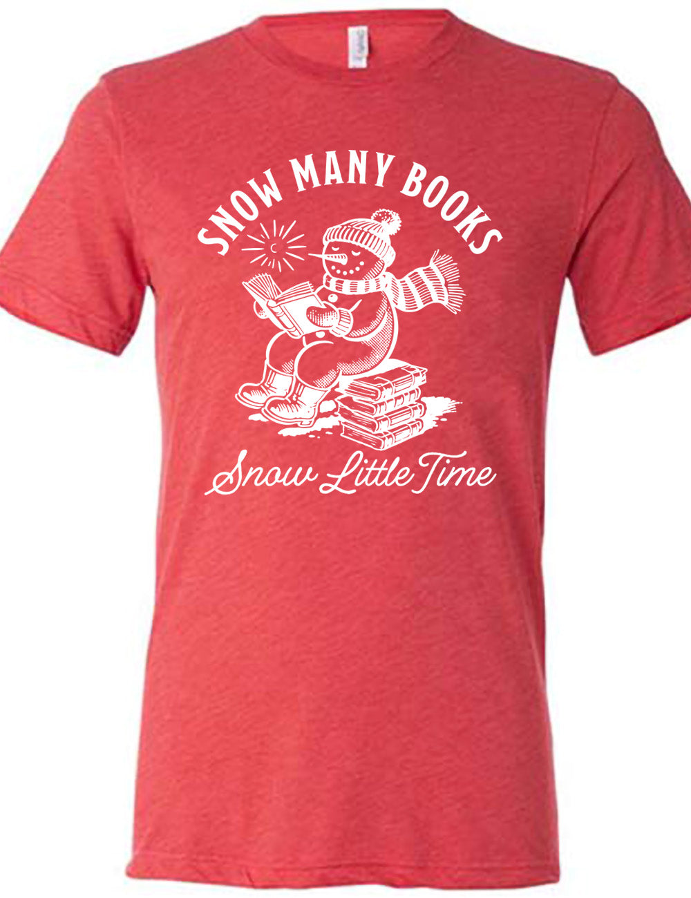 red unisex tee with the graphic of a happy snowman, wearing a snowsuit and boots, mittens, a hat, and book, reading a book while sitting on a stack of books, with a sun in the sky, and the words arching above saying "snow many books" and the words in a line of cursive below saying "snow little time"