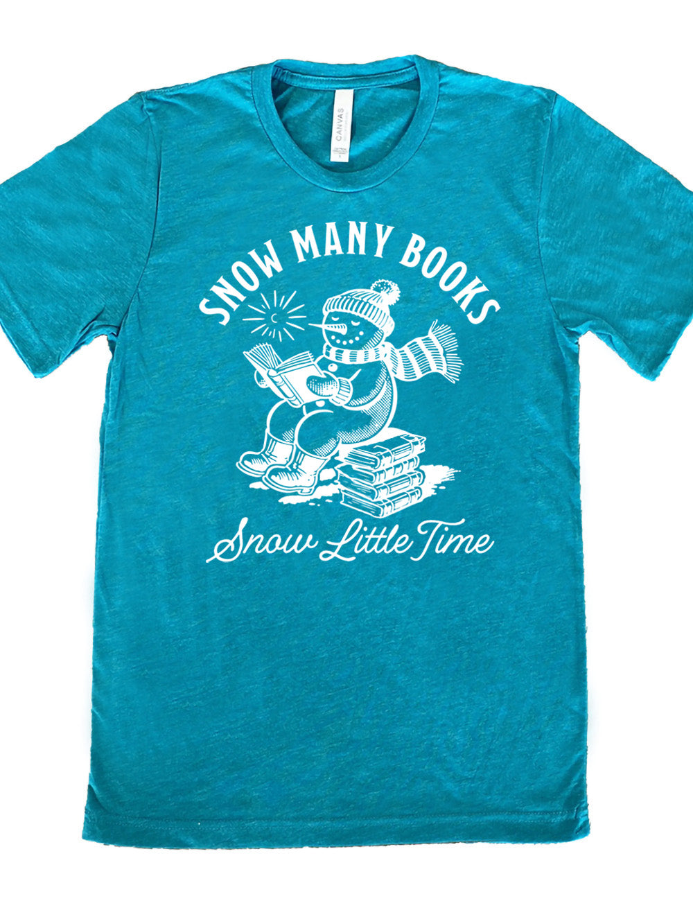 teal unisex tee with the graphic of a happy snowman, wearing a snowsuit and boots, mittens, a hat, and book, reading a book while sitting on a stack of books, with a sun in the sky, and the words arching above saying "snow many books" and the words in a line of cursive below saying "snow little time"