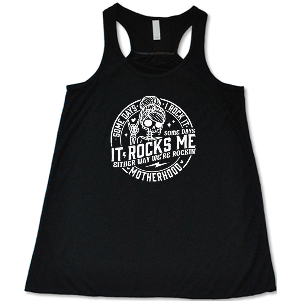 Black colored flowy tank with a female skeleton graphic on it that says "Some Days I Rock It Some Days It Rocks Me"