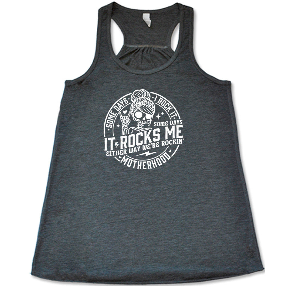 Grey colored flowy tank with a female skeleton graphic on it that says "Some Days I Rock It Some Days It Rocks Me"