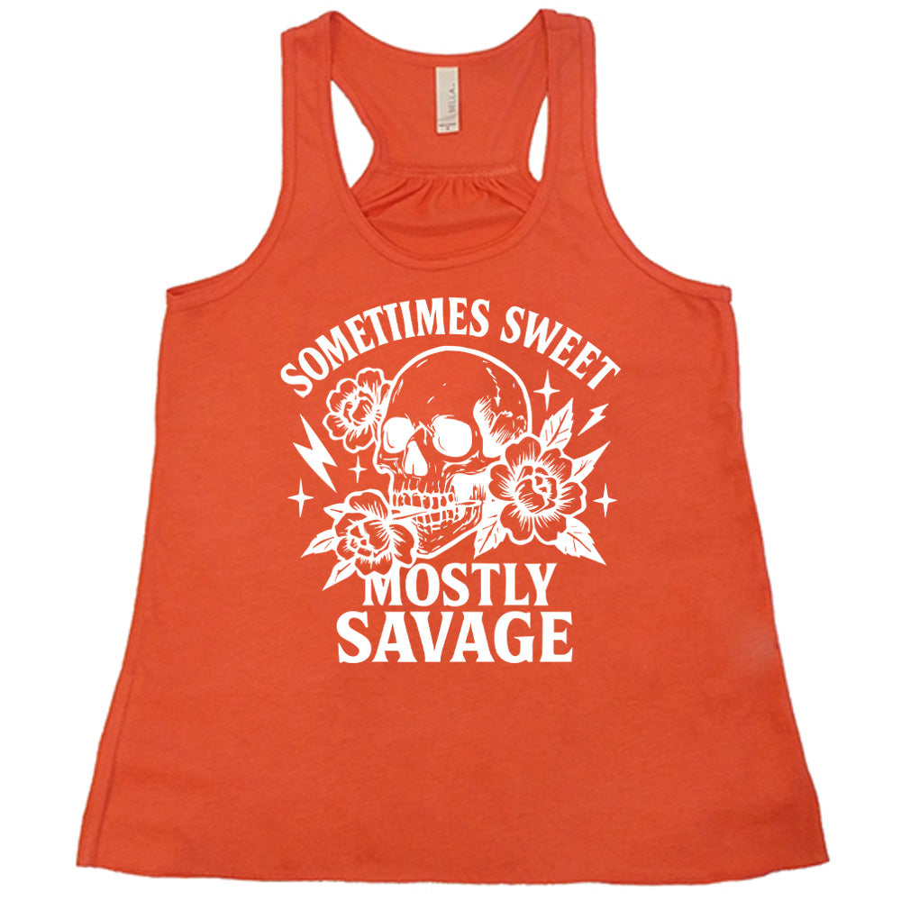 coral flowy tank with the words "sometimes sweet mostly savage on it with the graphic of a skull holding a flower between its teeth, with a couple flowers and a few stars and lightening bolts around it
