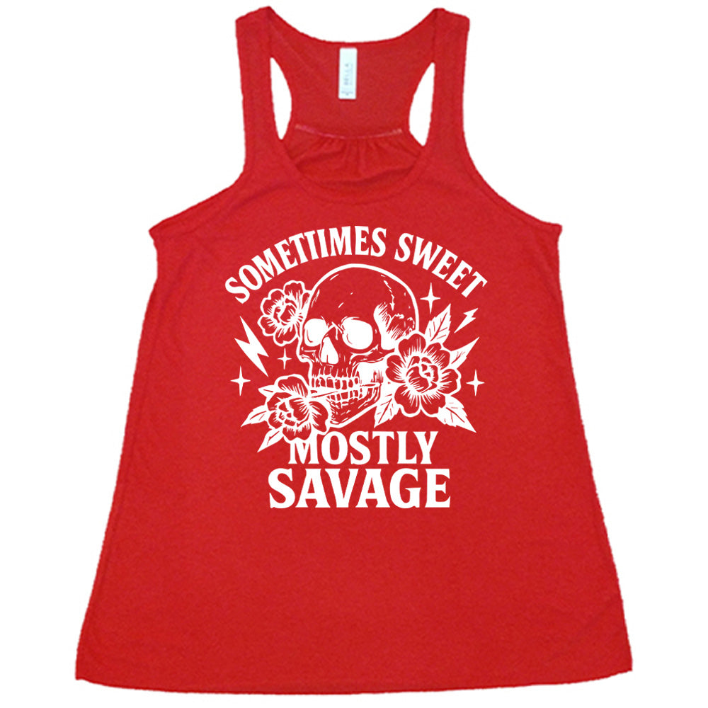red flowy tank with the words "sometimes sweet mostly savage on it with the graphic of a skull holding a flower between its teeth, with a couple flowers and a few stars and lightening bolts around it
