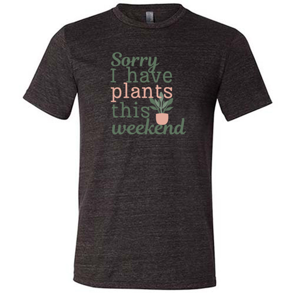 Black colored shirt with a potted plant graphic on it that says "Sorry I Have Plants This Weekend"