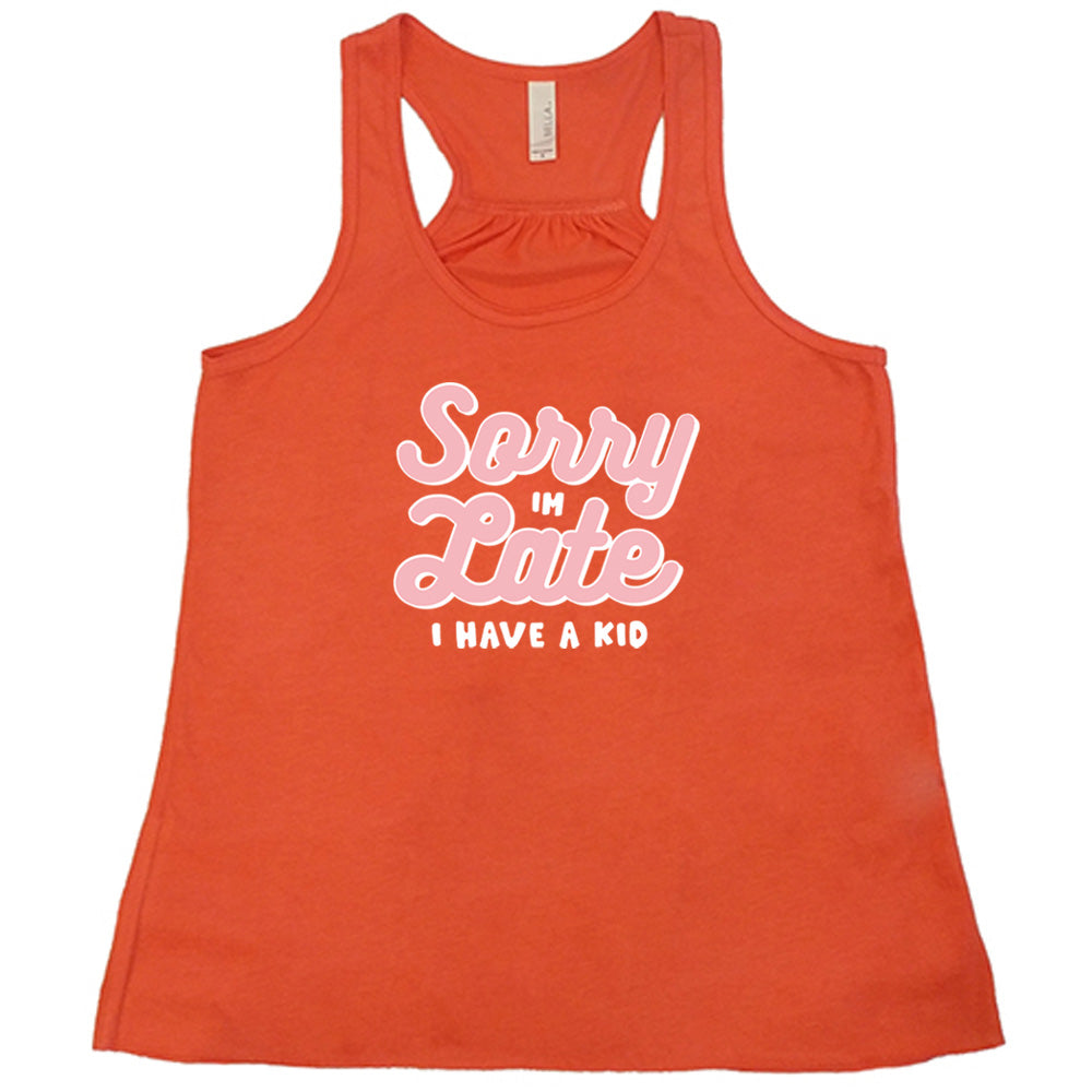 Coral colored flowy tank with a graphic on it that says "Sorry I'm Late, I Have A Kid"