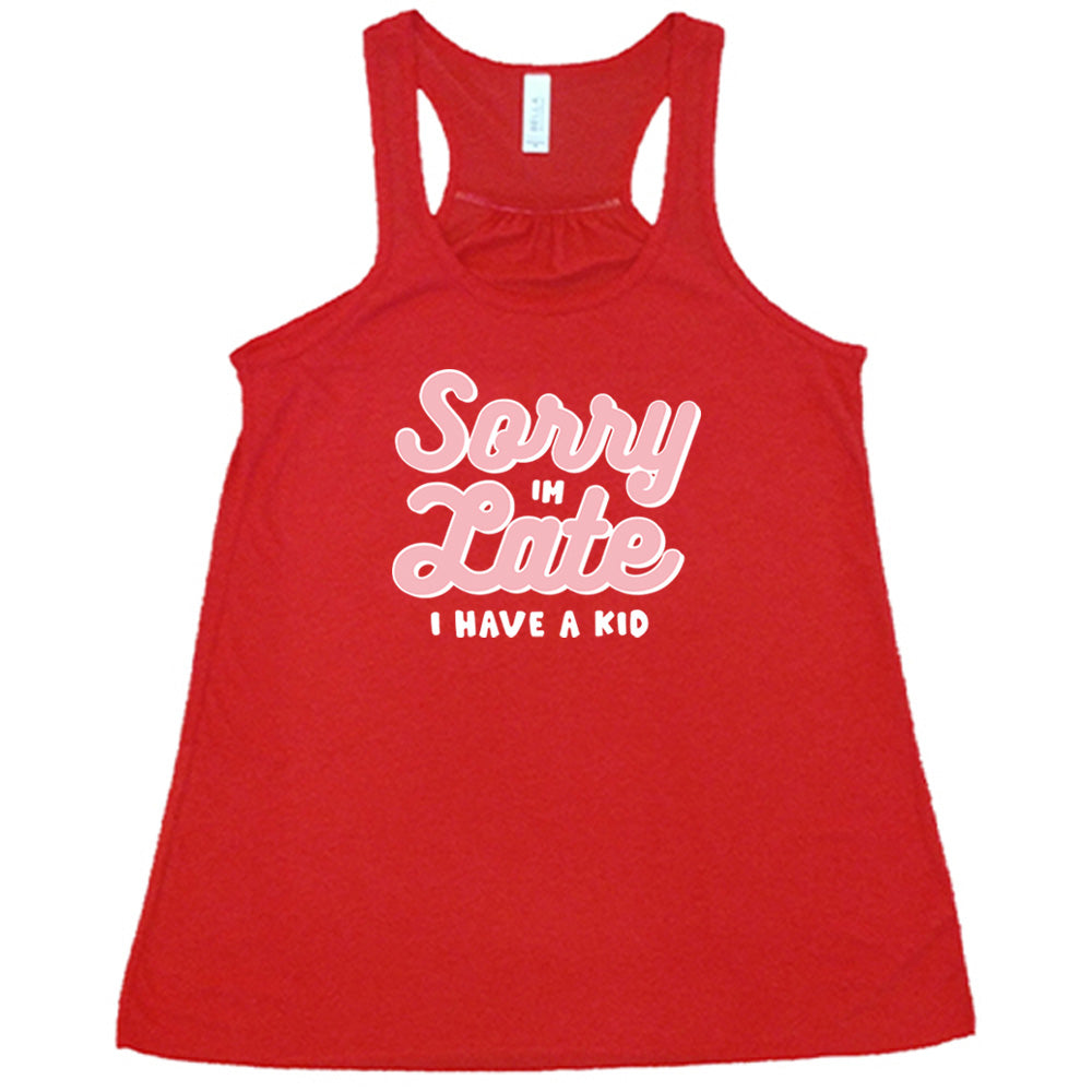 Red colored flowy tank with a graphic on it that says "Sorry I'm Late, I Have A Kid"