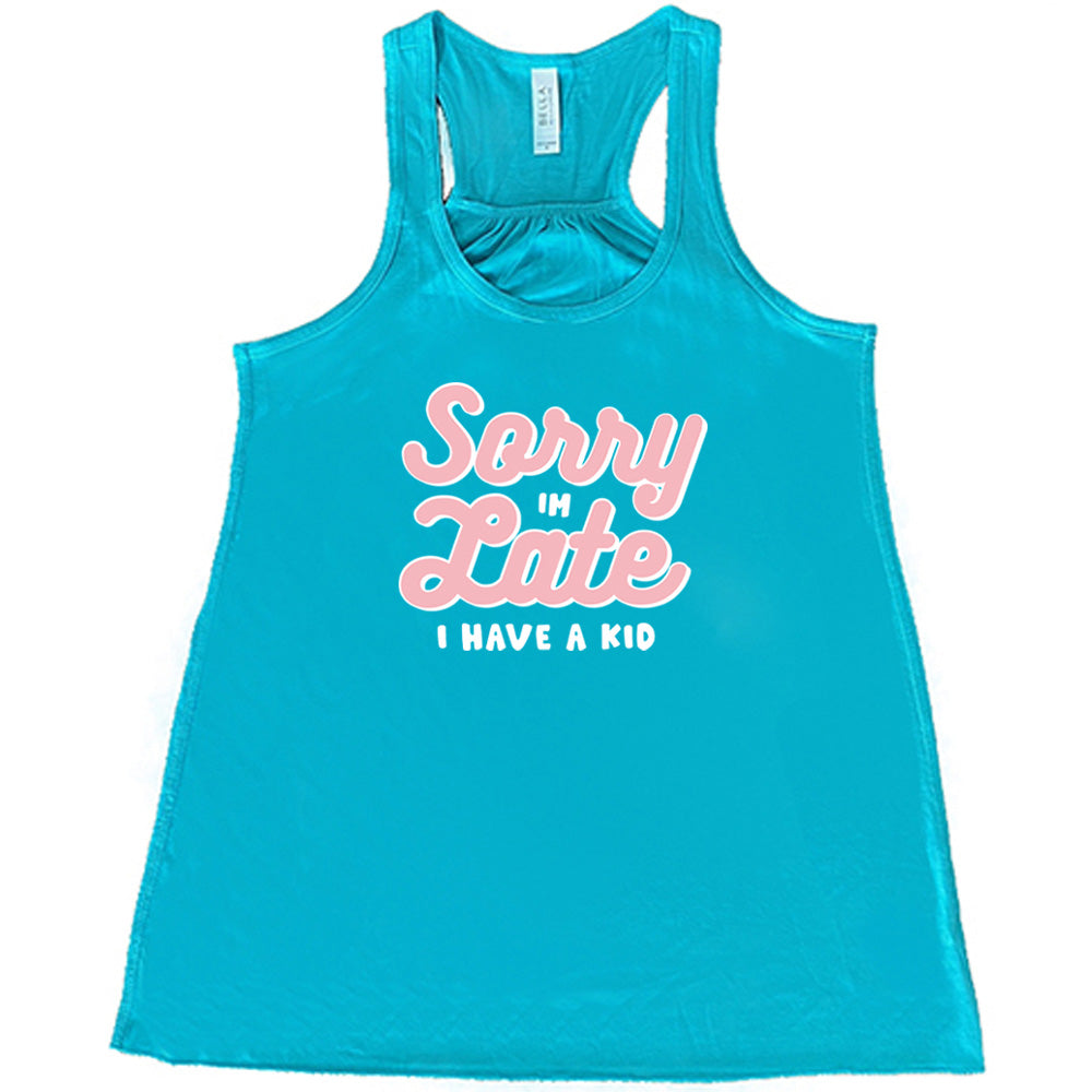 Teal colored flowy tank with a graphic on it that says "Sorry I'm Late, I Have A Kid"