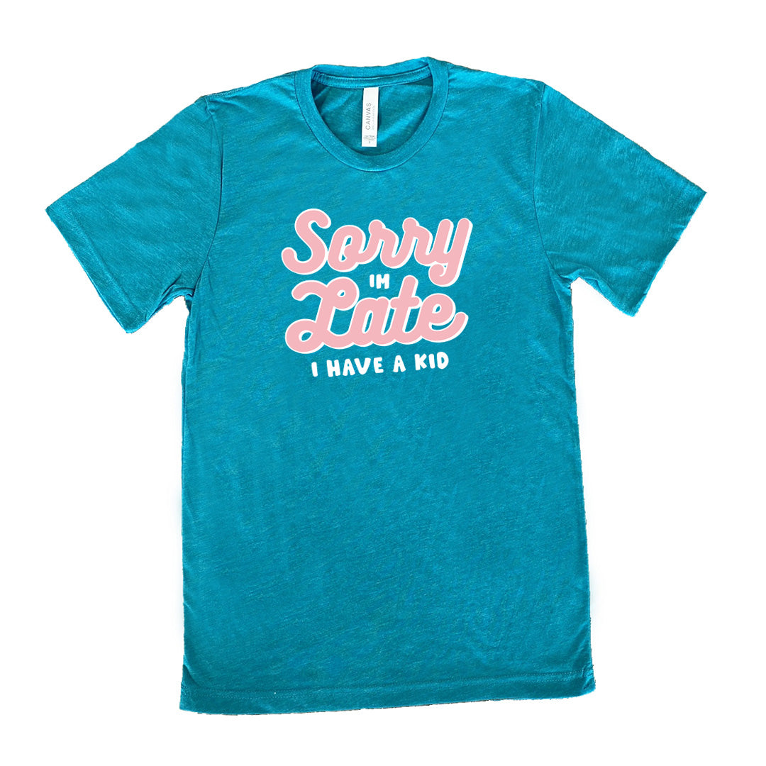 Teal colored shirt with a graphic on it that says "Sorry I'm Late, I Have A Kid"
