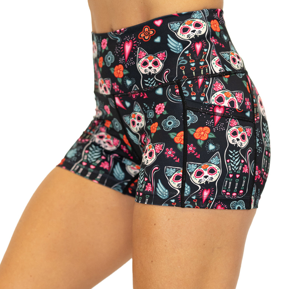 shorts with a colorful cat skull and floral design