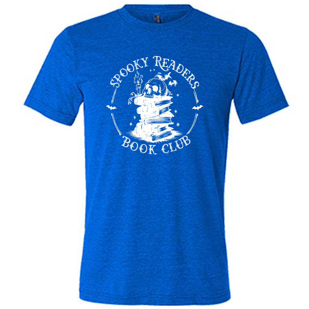 Blue colored shirt with skull on a stack of books graphic on it that says "Spooky Readers Book Club"