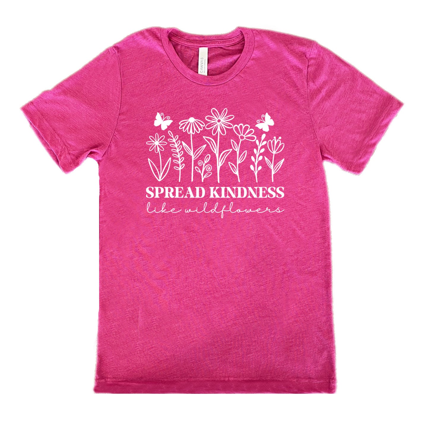 berry unisex tee with the graphics of wildflowers in a row, with the words "spread kindness like wildflowers" written underneath