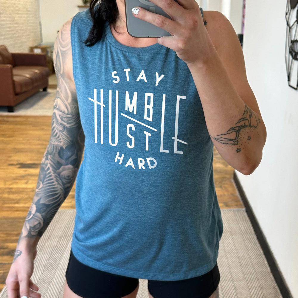 deal teal muscle tank with the words combined to say "stay humble hustle hard"