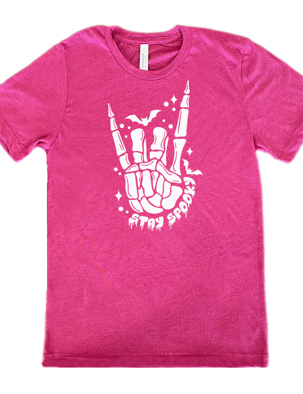 berry unisex tee with the large graphic of a rocker skeletal hand, with two little bats, and few stars and dots, with the words underneath saying "stay spooky"