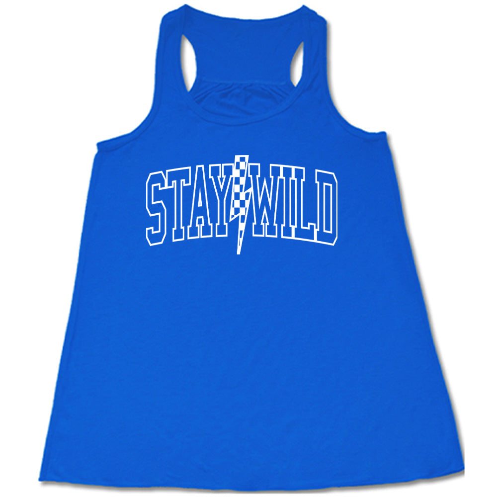 Blue colored flowy tank with a checkered lightning strike graphic on it that says "Stay Wild"