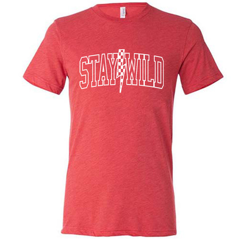 Red colored shirt with a checkered lightning strike graphic on it that says "Stay Wild"